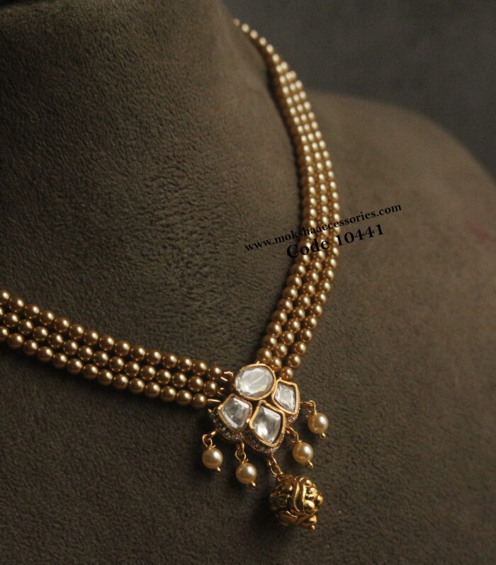 Mozonite stone pendant with gold sarvoski pearls and nakshi ball