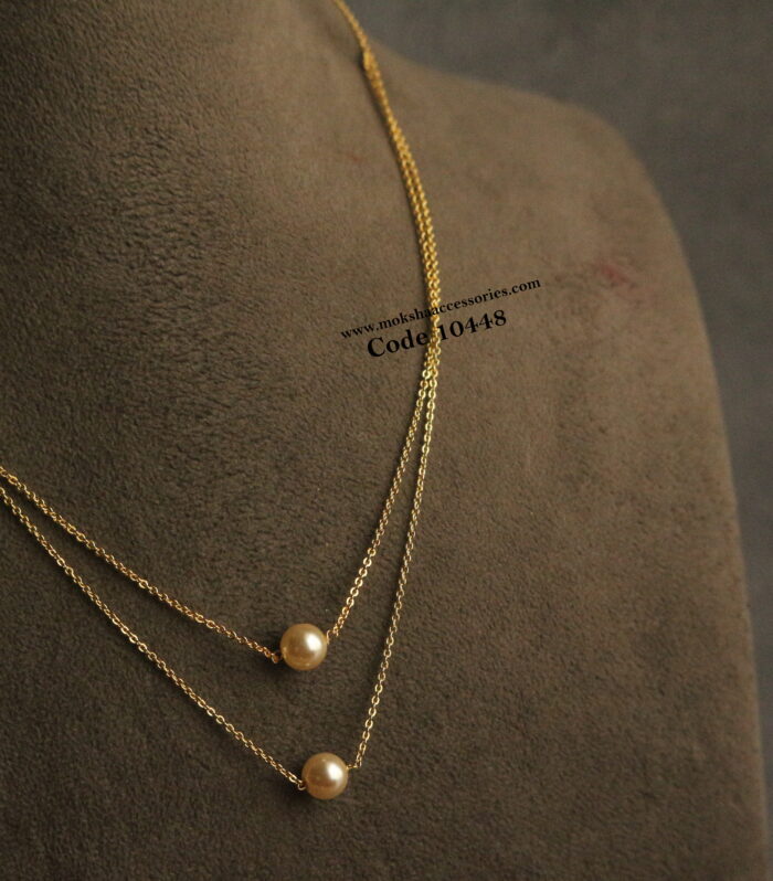 Gold chain with pearl drops