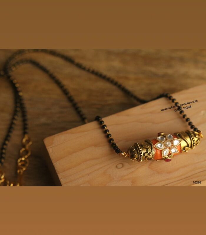 Real coral pendant with black beads