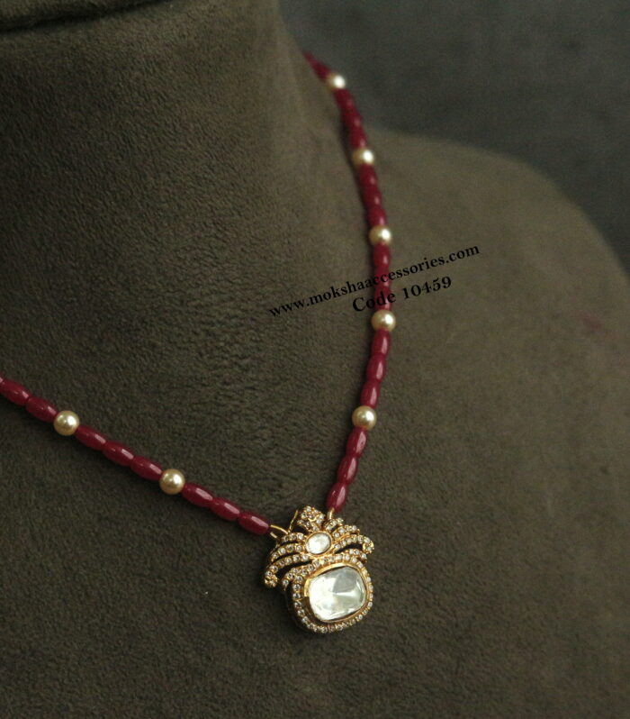 Mozonite stone pendant with real manulu and sarvoski pearls