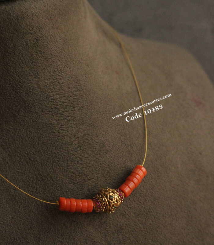 CZ gold nakshi balls with coral and invisible chain