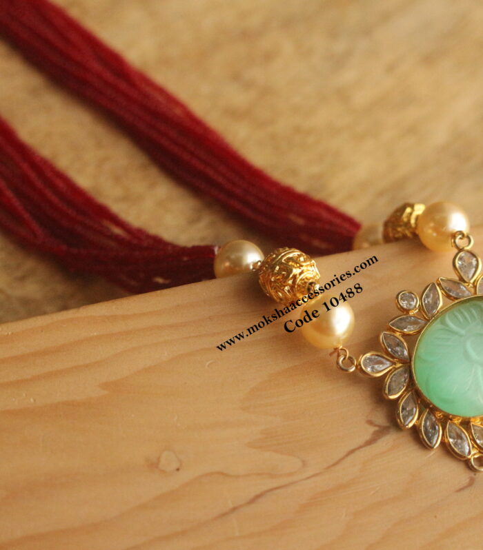 Carving cz pendant with gold balls and marroon beads