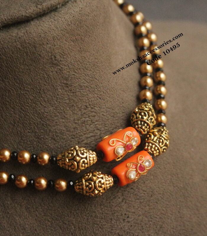 Coral, nakshi balls, sarvoski pearl and black beads mala