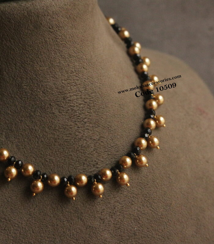Black beads and gold sarvoski pearl necklace