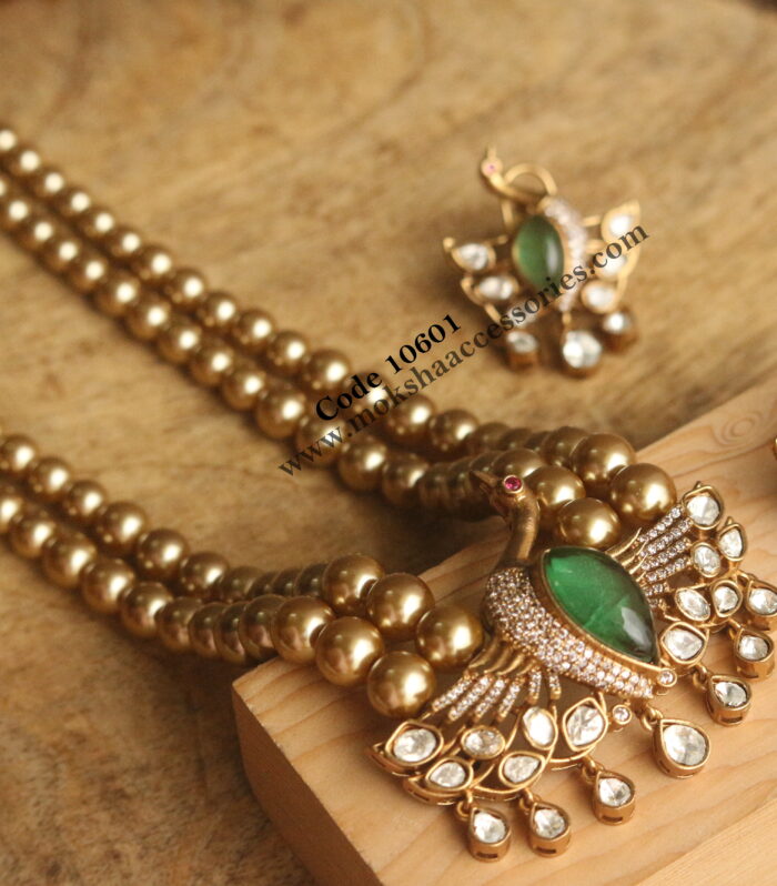 Mozonite and emerald stone pendant set with gold sarvoski pearls mala