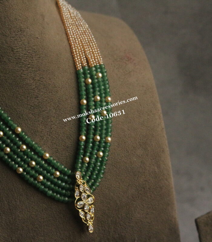 CZ pendant with emerald beads, onyx and sarvoski pearls