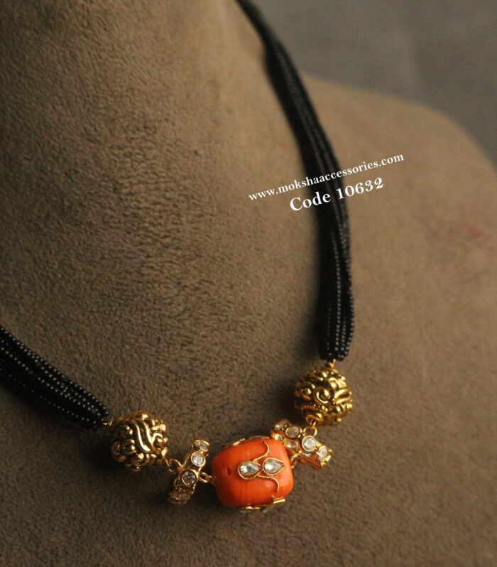 Coral with cz pendants, nakshi balls and black beads