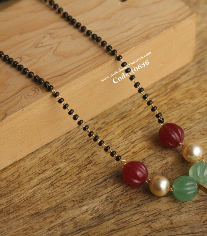 Mozonite stone pendant with pumpkin beads and black beads