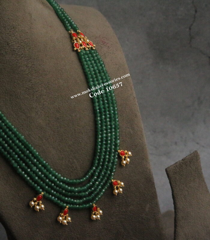 Emerald beads with coral jadaukundan pendants and sarvoski pearls
