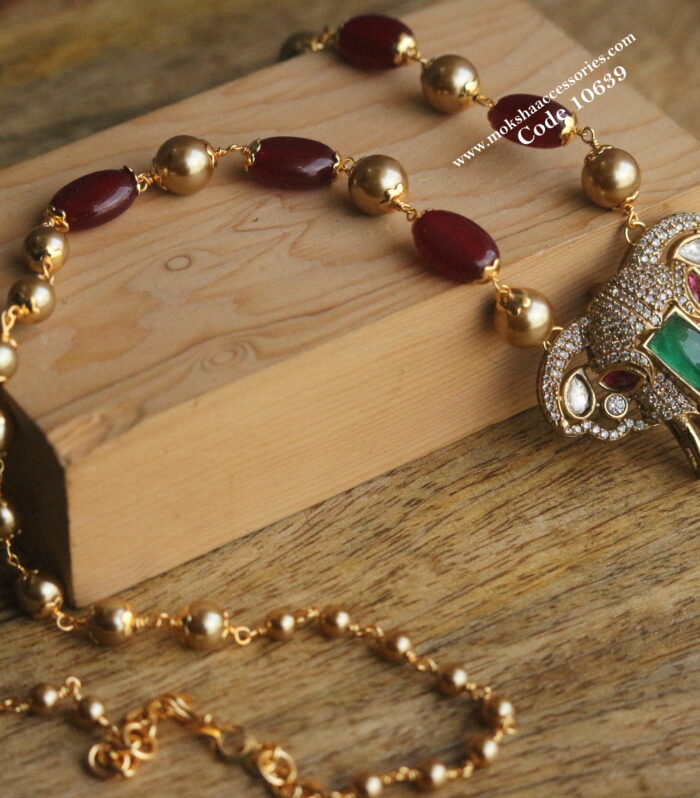 CZ elephant pendant with gold sarvoski pearls and onyx beads