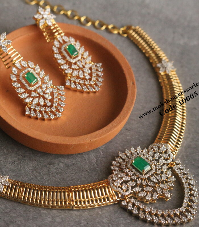 Gold necklace set with emerald and cz stone