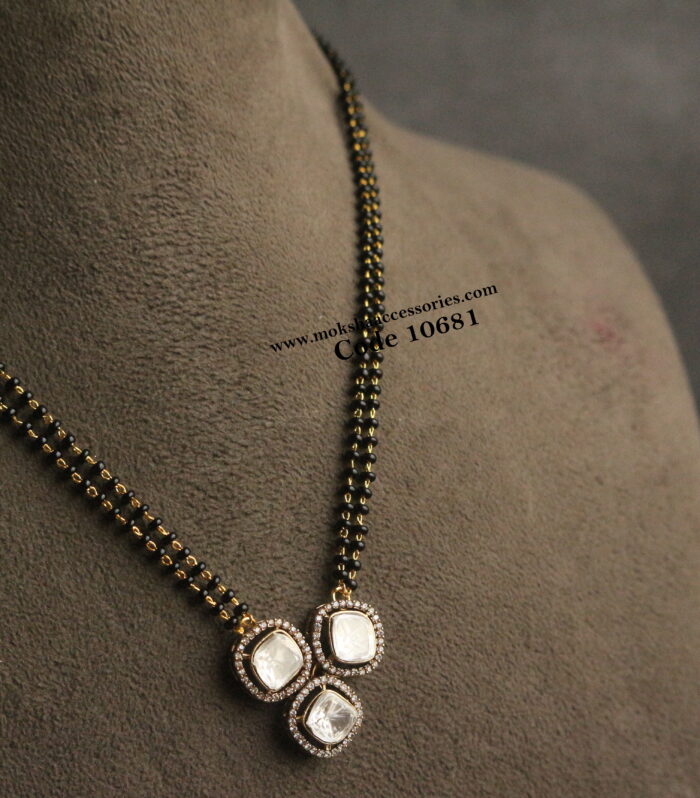 Mozonite stone pendant with black beads