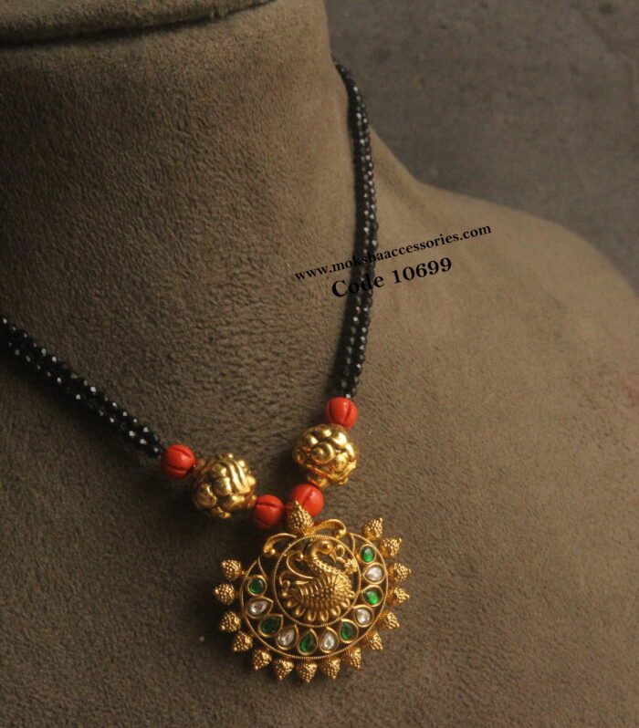 nakshi peacock pendant with corals and black beads