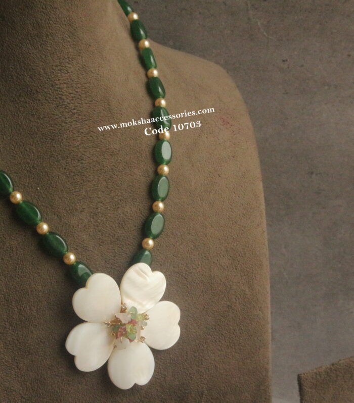 Shell pearl pendant with onyx beads and sarvoski pearls
