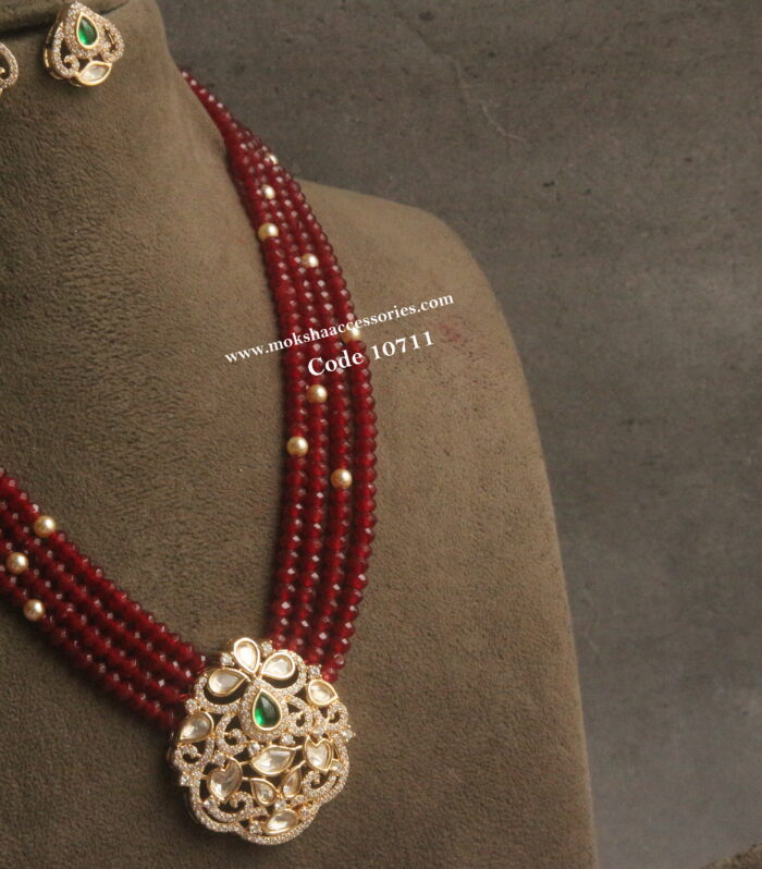Kundan pendant set with onyx maroon beads and sarvoski pearls