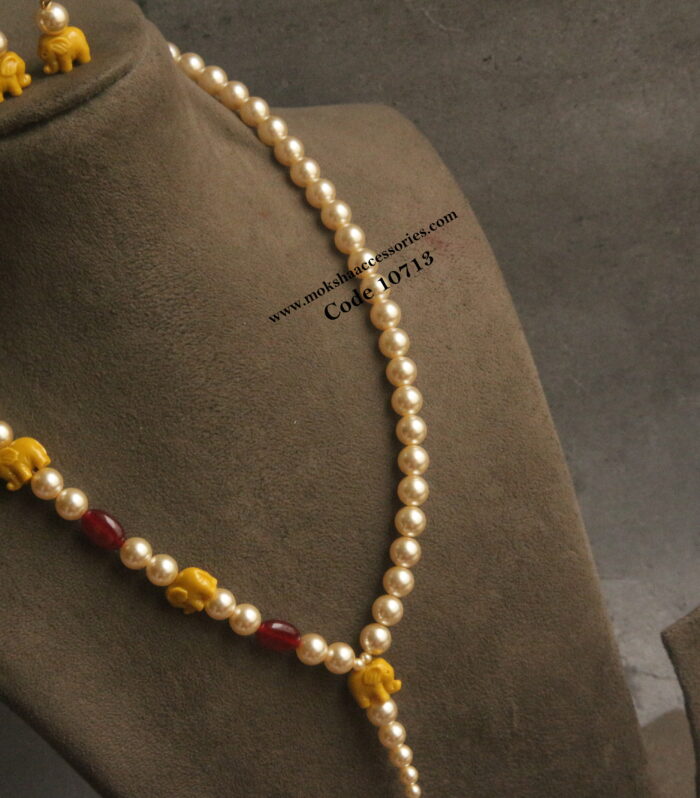 Elephant beads with sarvoski pearls and onyx beads