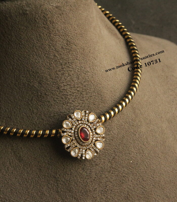 Black and gold hasli with Victorian pendant