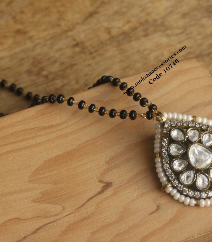 Mozonite stone pendant with black beads
