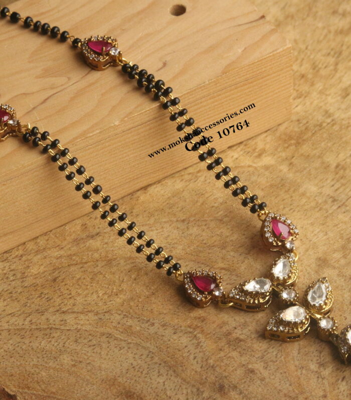 Mozonite stone pendant with black beads and nakshi gold drop