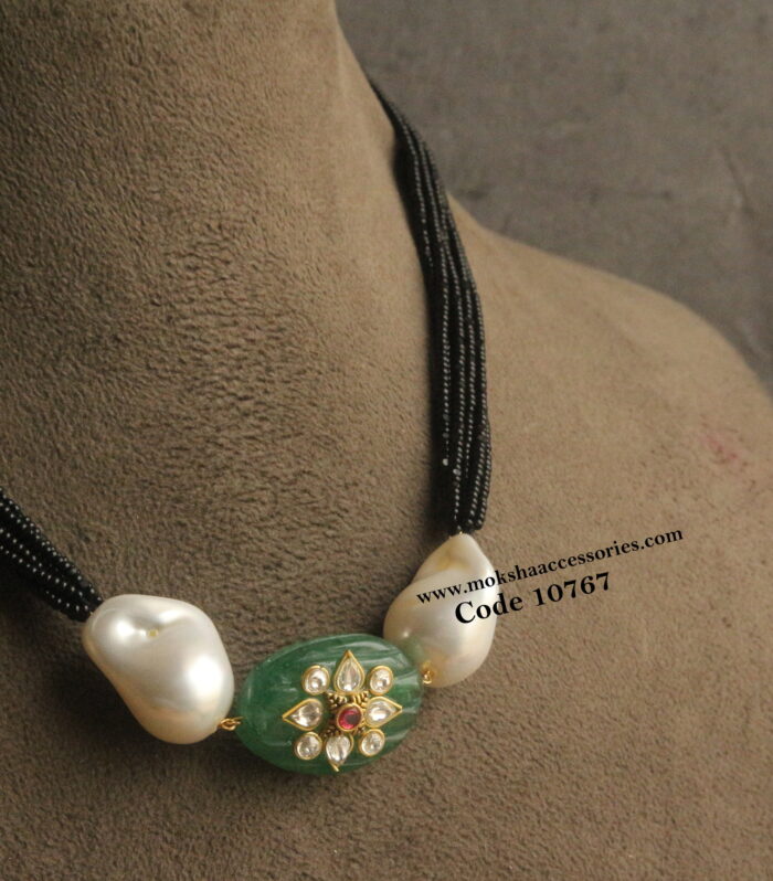 Black beads with beaded pendant and baroque pearls