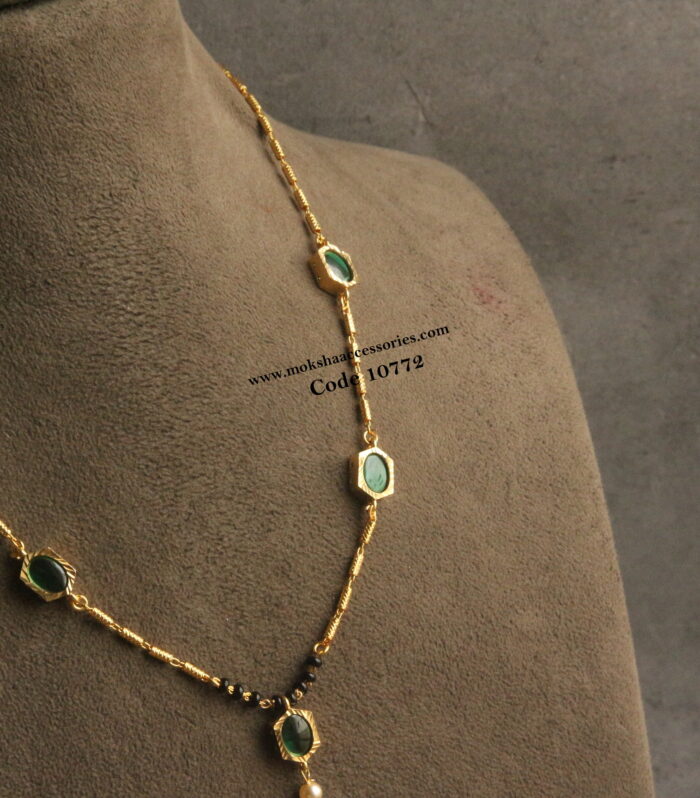 Gold chain with cz pendants and black beads