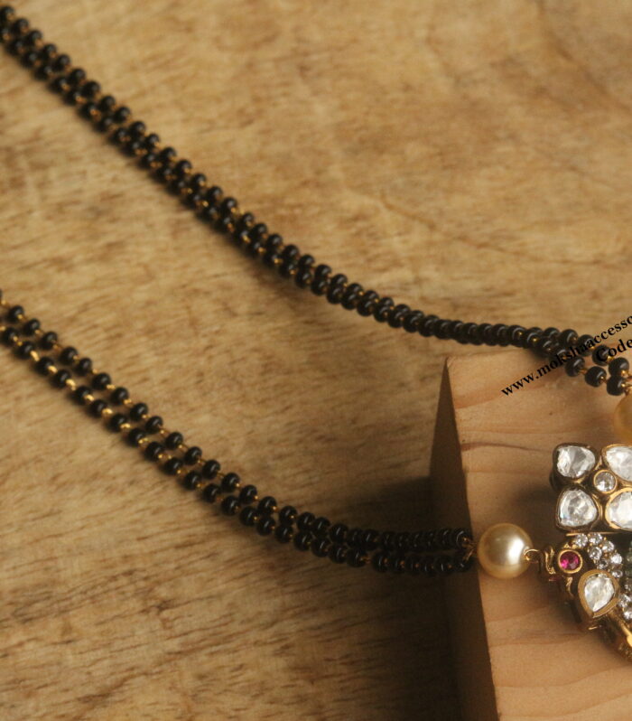 Mozonite stone pendant with black beads