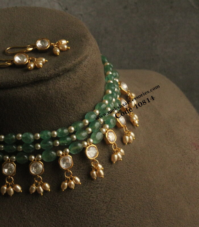 Emerald and sarvoski pearl choker set with mozonite stone pendants