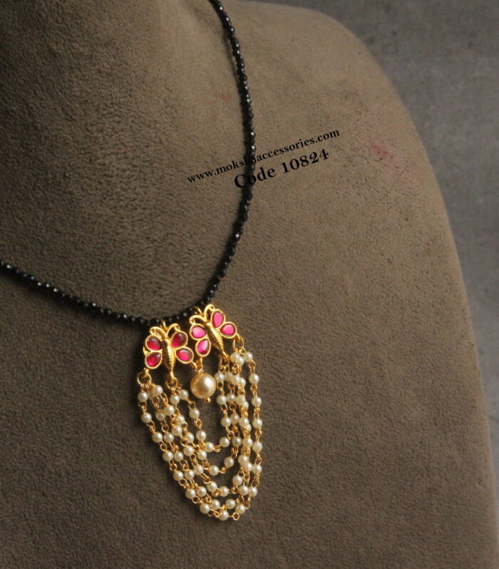 Black beads with jadaukundan pendants and pearl chain