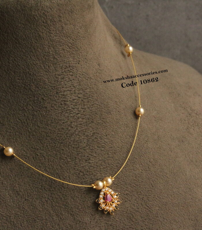 CZ ruby and black stone pendant with invisible chain and sarvoski pearls