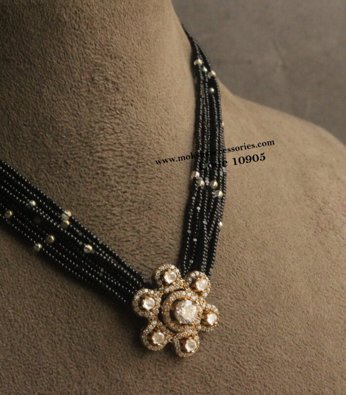 Mozonite stone pendant with black beads
