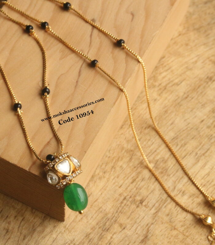 Mozonite stone pendant with black beads and gold chain