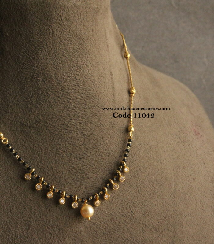 Black beads with gold chain and cz drops