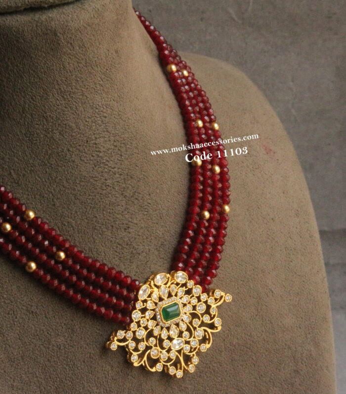 CZ pendant with emerald beads and sarvoski gold sarvoski pearls