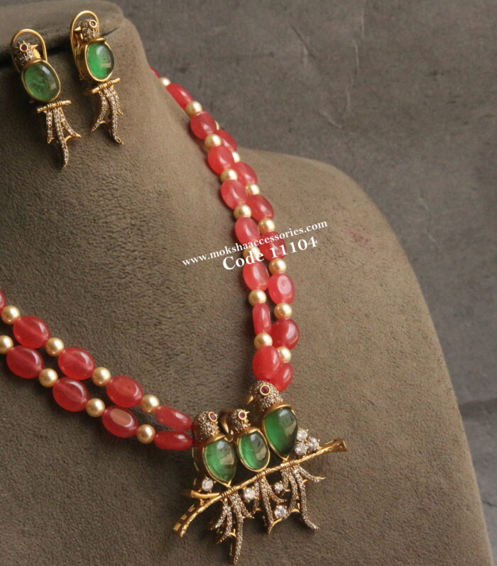CZ bird pendant set with onyx beads and sarvoski pearls