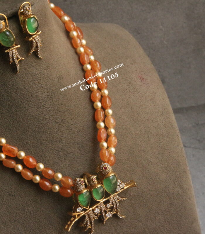 CZ bird pendant set with onyx beads and sarvoski pearls