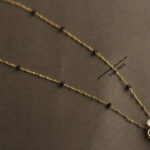 Mozonite Stone Pendant with Gold Chain and Black Beads