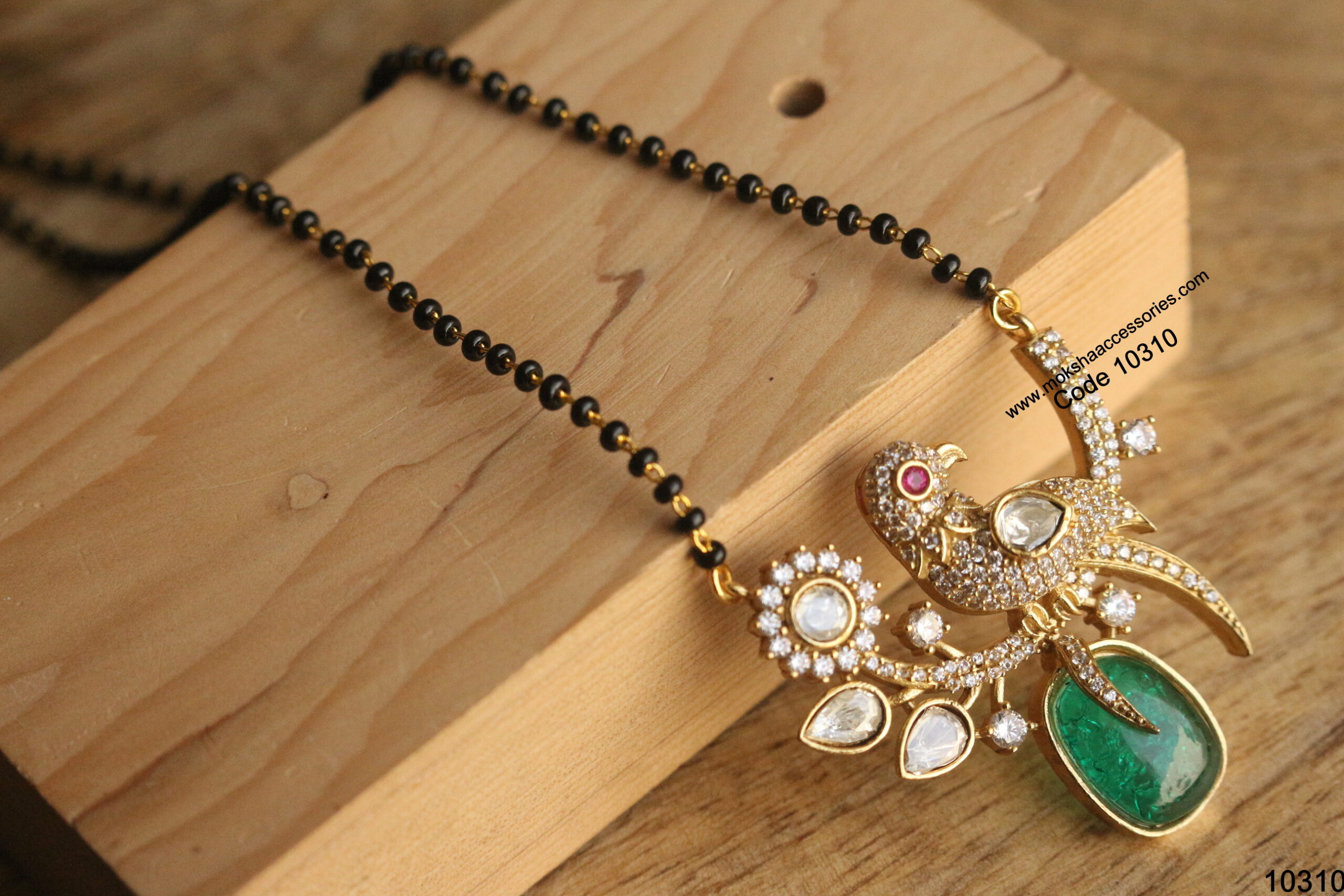 10310-scaled-1.jpg Mozonite Stone Bird Pendant with Black Beads - Image 1