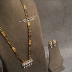 Diamond Alike Pendant Set with Black Beads and Gold Chain Haram (22 Inches Length)