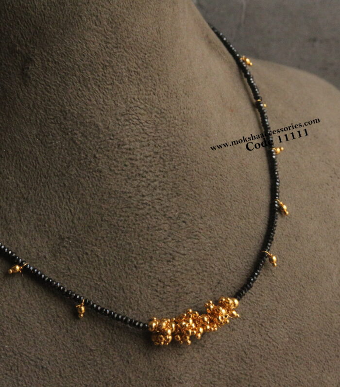 Black beads with gold drops