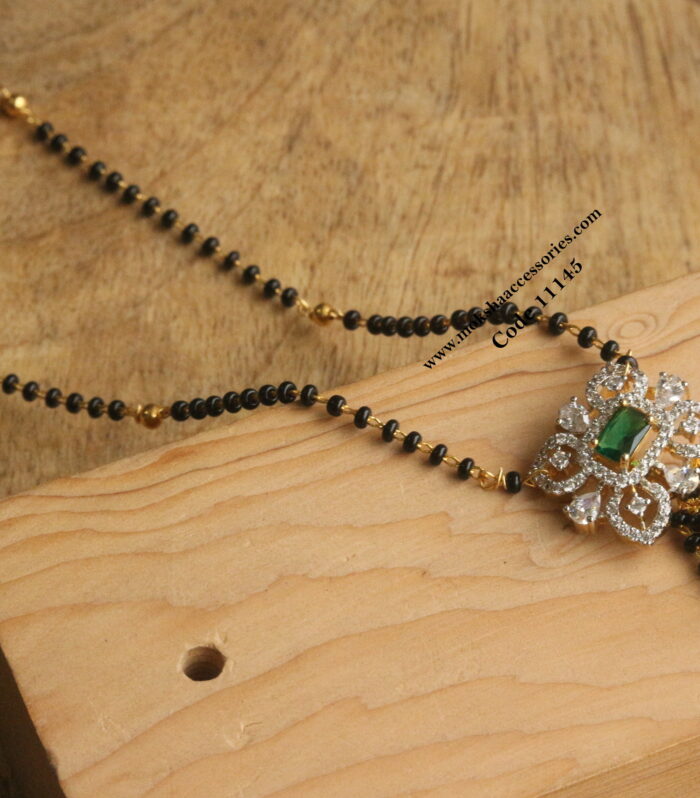 CZ pendant with black beads and gold balls
