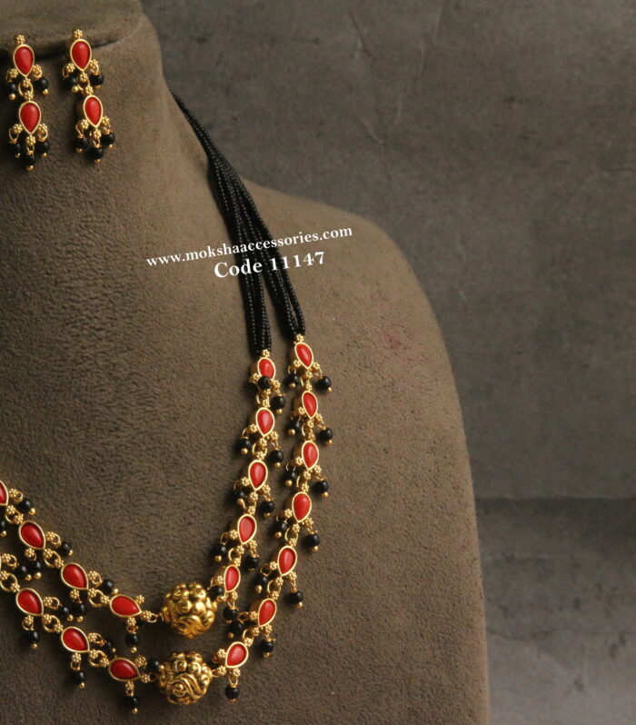 Corals and black beads neckset with nakshi balls and earrings