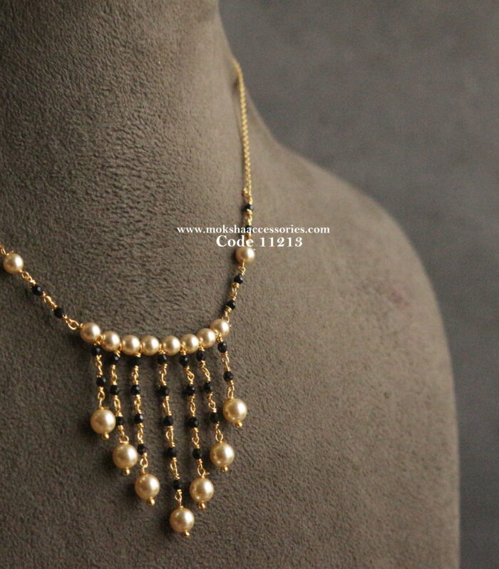 Black beads with gold chain and sarvoski pearls