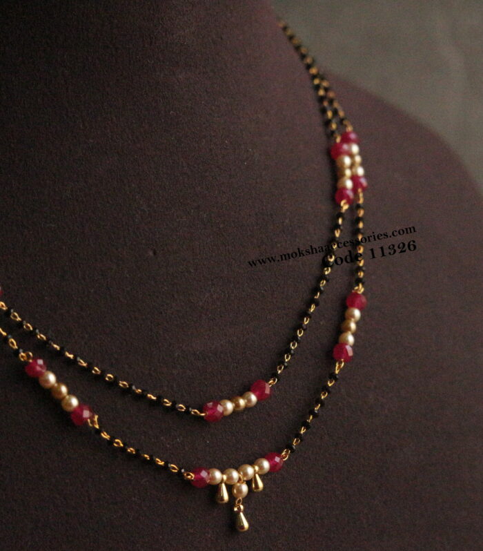 Black beads with corals and sarvoski pearls
