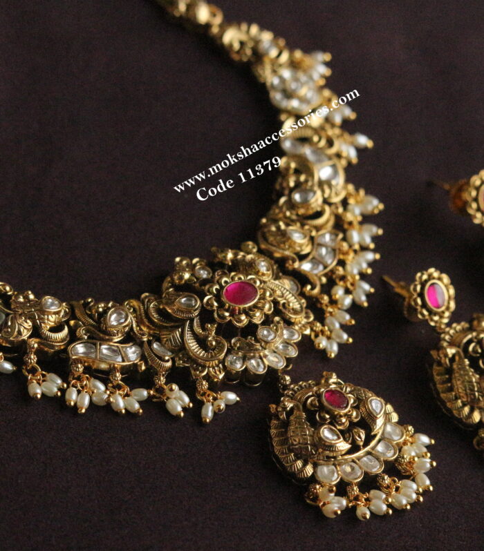 Nakshi mozonite and ruby stone neckset with rice pearls