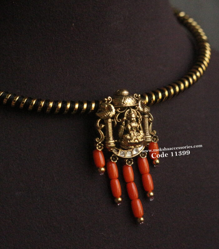 Black and gold hasli with nakshi pendant and corals