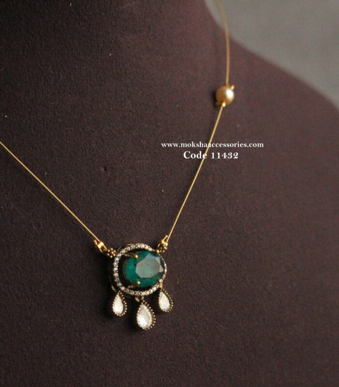 CZ emerald and mozonite stone pendant with invisible chain