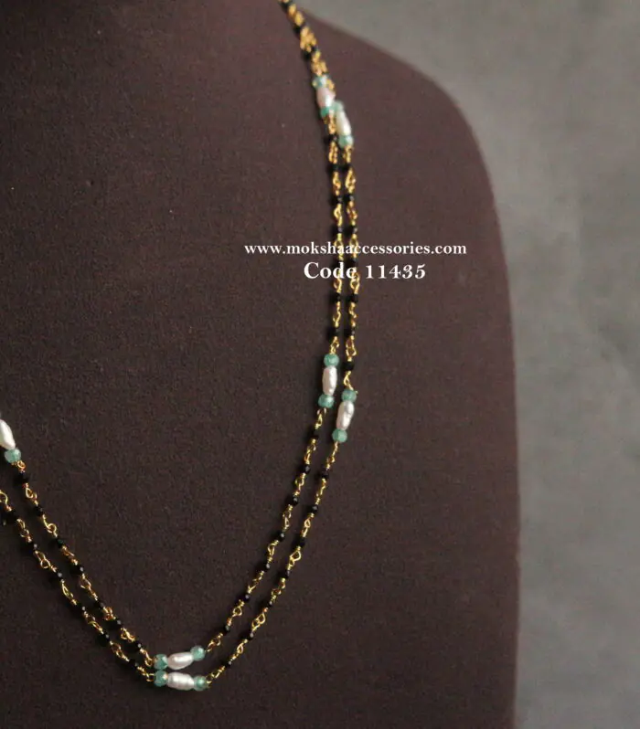Black beads with real pearls and cz beads