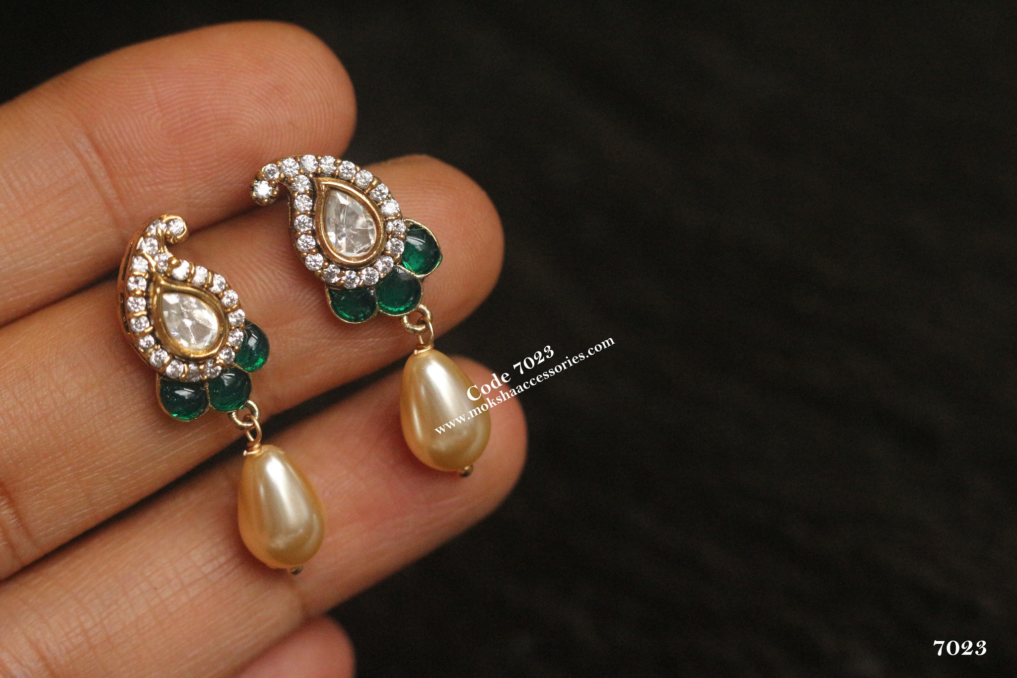 Kundan and emerald stone earrings Kundan and emerald stone earrings