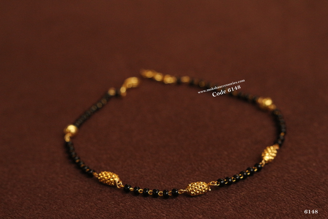 6148.jpg Black Beads Bracelet with Gold Balls - Image 1