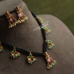 Lakshmi Devi Pendant Set with Jadaukundans and Black Beads